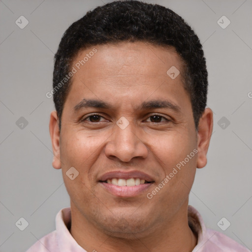 Joyful latino adult male with short  brown hair and brown eyes