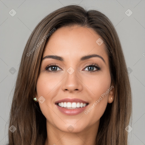 Joyful white young-adult female with long  brown hair and brown eyes