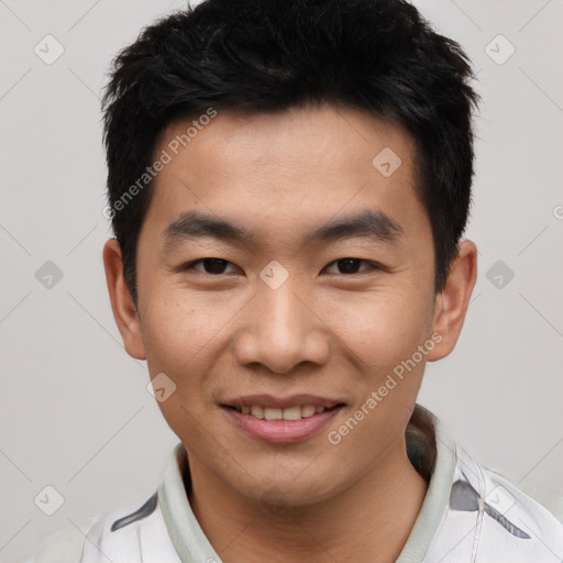 Joyful asian young-adult male with short  black hair and brown eyes