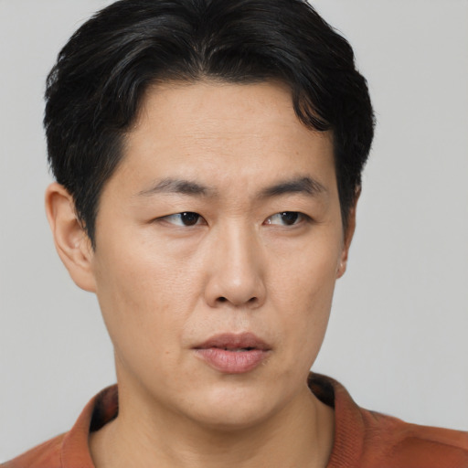 Neutral asian young-adult male with short  black hair and brown eyes