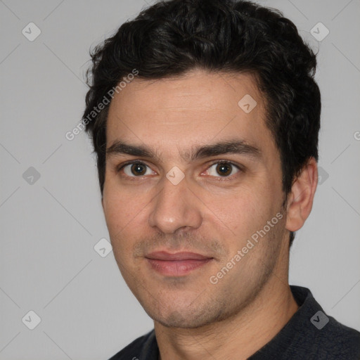 Joyful white young-adult male with short  black hair and brown eyes