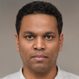 Neutral latino young-adult male with short  brown hair and brown eyes