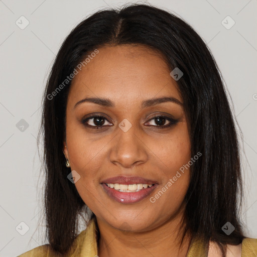 Joyful black young-adult female with long  brown hair and brown eyes