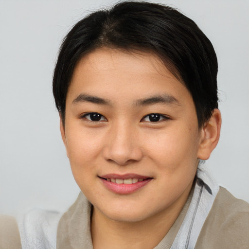 Joyful asian young-adult female with short  brown hair and brown eyes