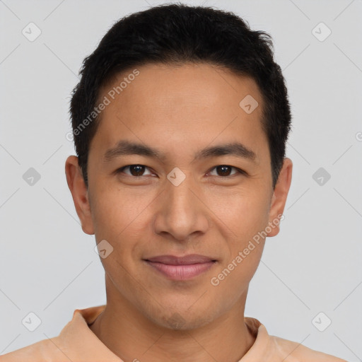 Joyful latino young-adult male with short  brown hair and brown eyes