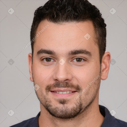 Joyful white young-adult male with short  brown hair and brown eyes