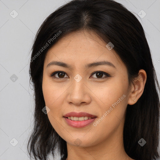 Joyful asian young-adult female with long  brown hair and brown eyes