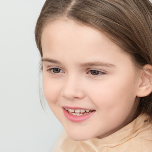 Joyful white child female with medium  brown hair and brown eyes