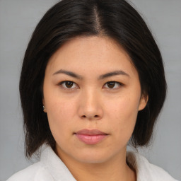 Neutral asian young-adult female with medium  brown hair and brown eyes