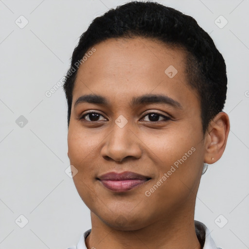 Joyful latino young-adult female with short  black hair and brown eyes