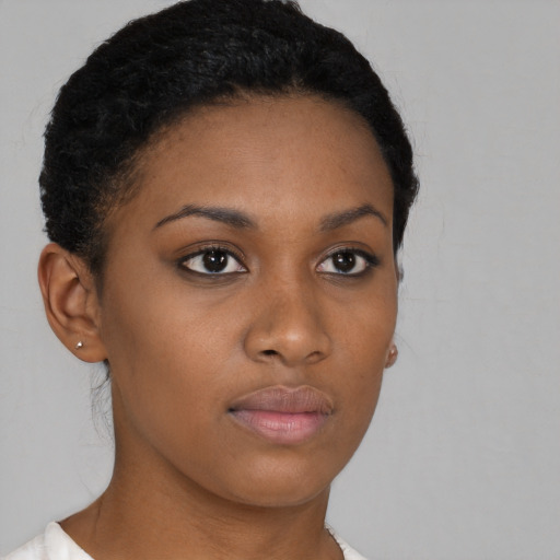 Neutral black young-adult female with short  brown hair and brown eyes