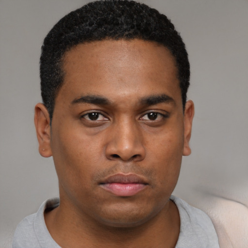 Neutral black young-adult male with short  black hair and brown eyes