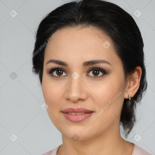 Joyful latino young-adult female with medium  brown hair and brown eyes