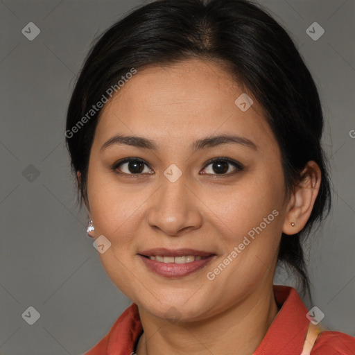 Joyful latino young-adult female with medium  brown hair and brown eyes