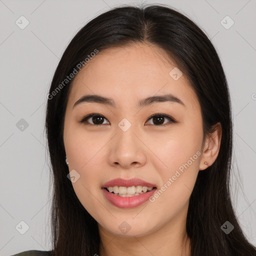 Joyful asian young-adult female with long  brown hair and brown eyes