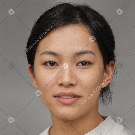 Joyful asian young-adult female with short  black hair and brown eyes