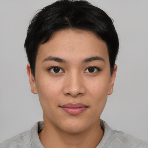 Joyful asian young-adult female with short  black hair and brown eyes