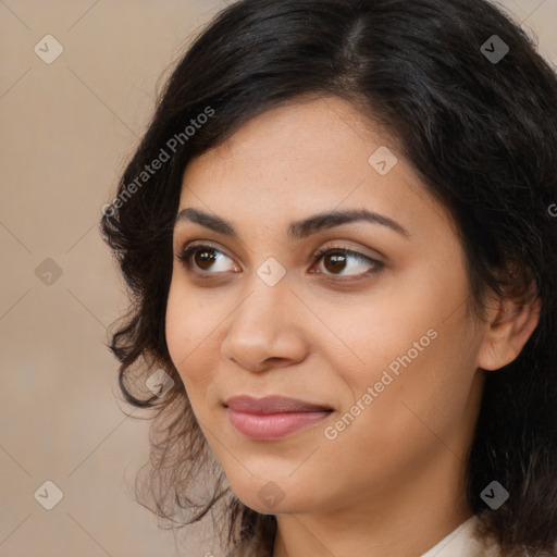 Joyful latino young-adult female with long  brown hair and brown eyes