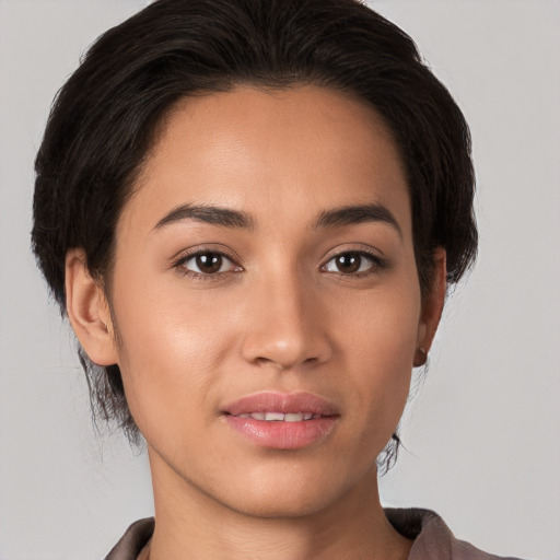 Joyful white young-adult female with medium  brown hair and brown eyes