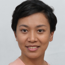 Joyful asian young-adult female with short  brown hair and brown eyes