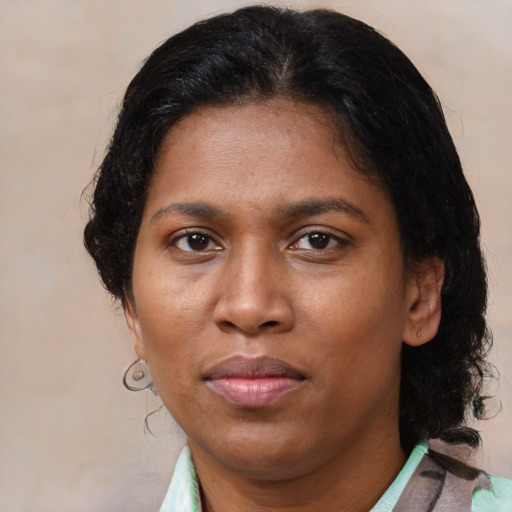 Neutral latino adult female with medium  brown hair and brown eyes