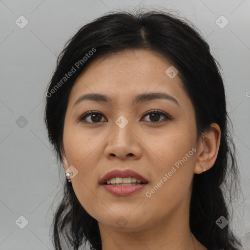 Joyful asian young-adult female with medium  brown hair and brown eyes