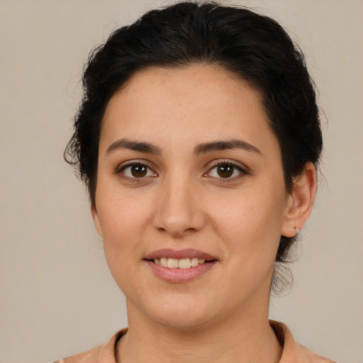 Joyful white young-adult female with medium  brown hair and brown eyes
