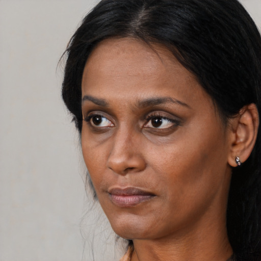 Neutral black young-adult female with long  black hair and brown eyes