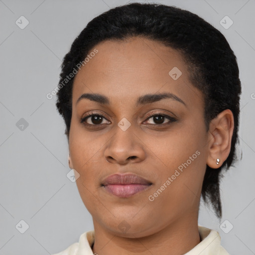 Joyful black young-adult female with short  brown hair and brown eyes