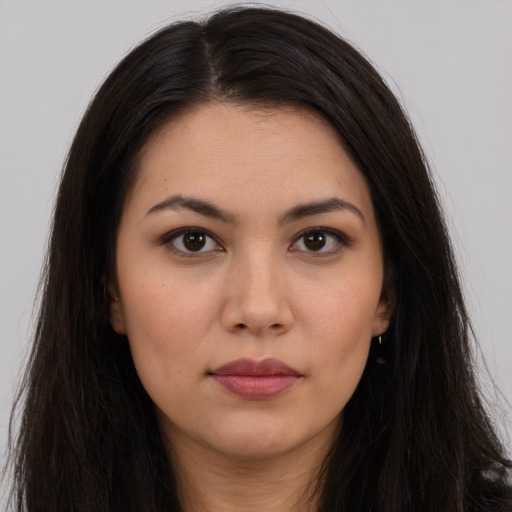 Neutral latino young-adult female with long  brown hair and brown eyes