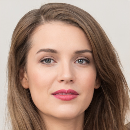 Joyful white young-adult female with long  brown hair and grey eyes