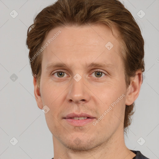 Joyful white adult male with short  brown hair and grey eyes