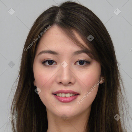 Joyful asian young-adult female with long  brown hair and brown eyes