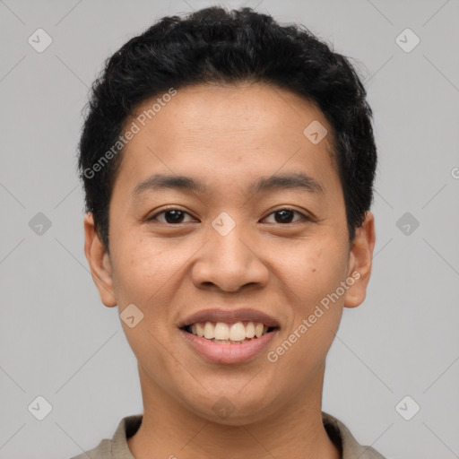 Joyful latino young-adult male with short  black hair and brown eyes