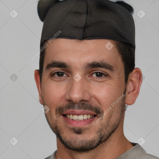 Joyful white young-adult male with short  black hair and brown eyes