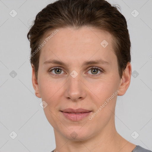 Joyful white adult female with short  brown hair and grey eyes