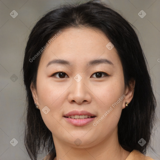 Joyful asian young-adult female with medium  brown hair and brown eyes