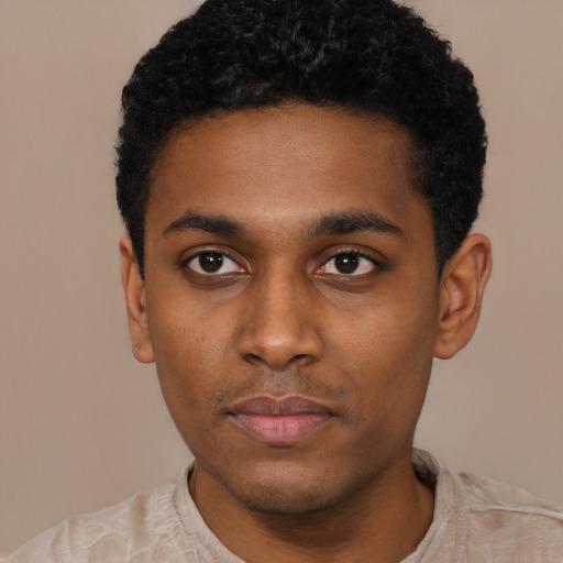 Neutral black young-adult male with short  black hair and brown eyes