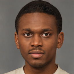 Neutral latino young-adult male with short  brown hair and brown eyes
