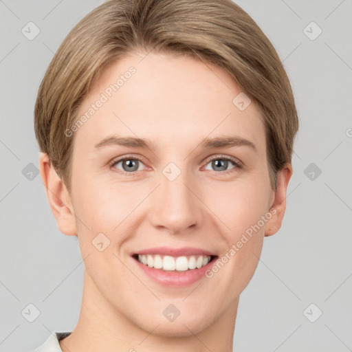 Joyful white young-adult female with short  brown hair and grey eyes