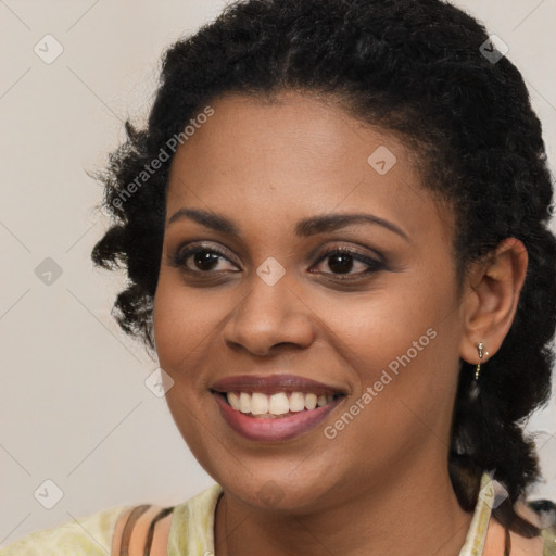 Joyful black young-adult female with medium  brown hair and brown eyes