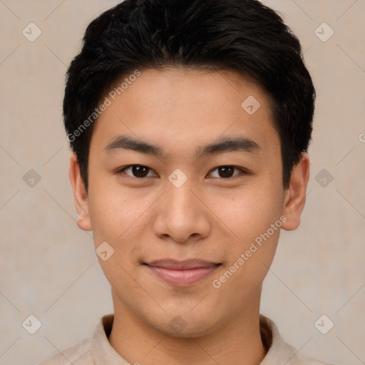 Joyful asian young-adult male with short  black hair and brown eyes