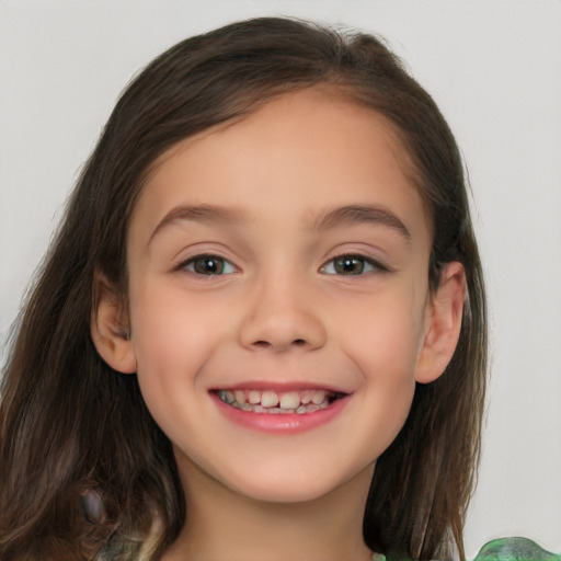 Joyful white child female with long  brown hair and brown eyes