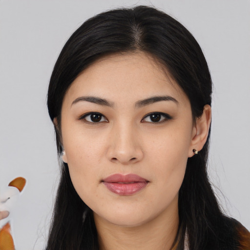Joyful asian young-adult female with long  black hair and brown eyes