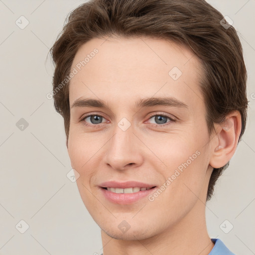 Joyful white young-adult female with short  brown hair and grey eyes