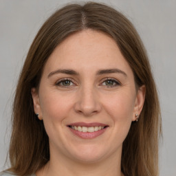 Joyful white young-adult female with medium  brown hair and grey eyes