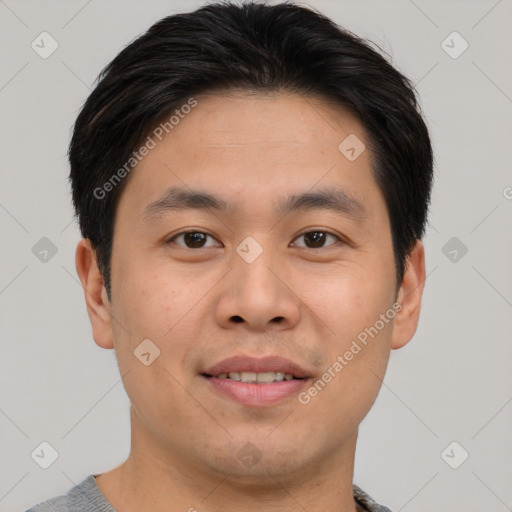 Joyful asian young-adult male with short  brown hair and brown eyes