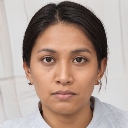 Neutral asian young-adult female with medium  brown hair and brown eyes