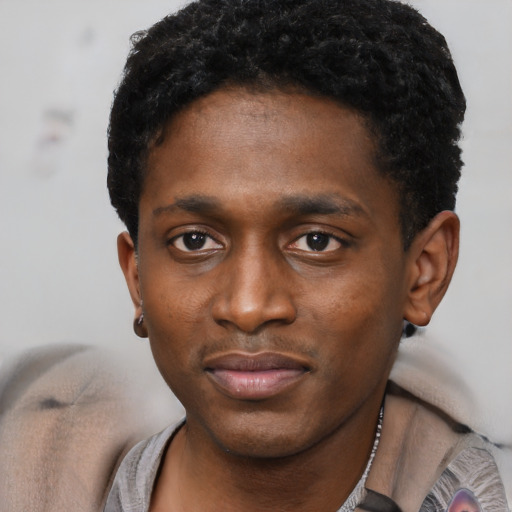 Neutral black young-adult male with short  black hair and brown eyes