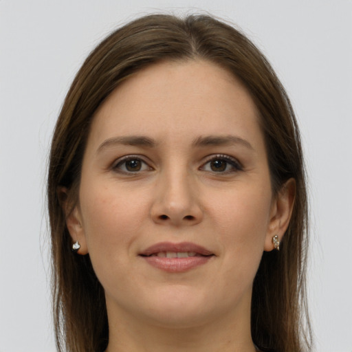 Joyful white young-adult female with long  brown hair and grey eyes